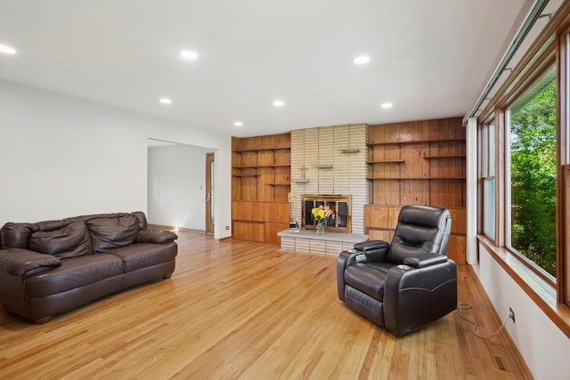 133 Maple Ct, Bloomingdale, IL 60108 - living area with light wood-style flooring, recessed lighting, a fireplace, baseboards, and built in shelves