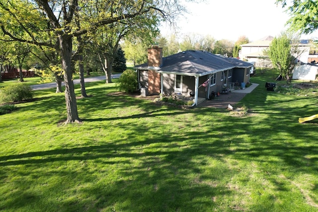 133 Maple Ct, Bloomingdale, IL 60108 - view of green lawn with a patio area