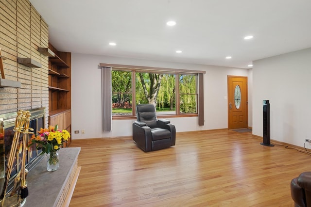 133 Maple Ct, Bloomingdale, IL 60108 - living area with light wood-style flooring, recessed lighting, a fireplace, and baseboards