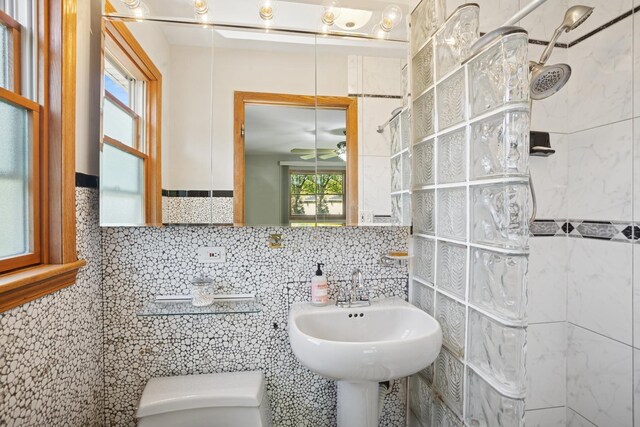 133 Maple Ct, Bloomingdale, IL 60108 - full bath with toilet, healthy amount of natural light, a tile shower, tile walls, and a sink