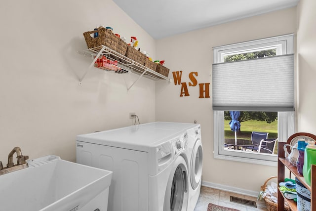 930 Ripple Brook Ln, Elgin, IL 60120 - clothes washing area with independent washer and dryer, light tile patterned floors, and baseboards