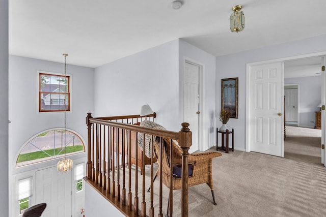 930 Ripple Brook Ln, Elgin, IL 60120 - hallway with a chandelier, carpet, baseboards, and an upstairs landing