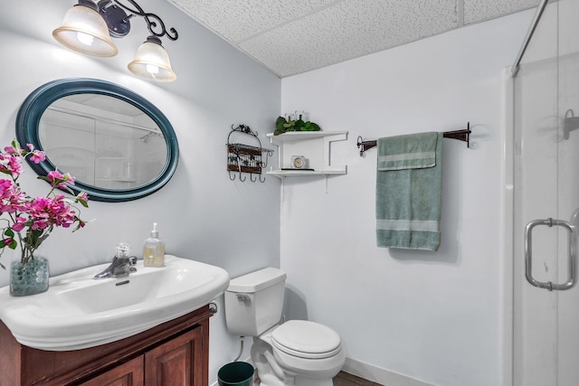 930 Ripple Brook Ln, Elgin, IL 60120 - bathroom featuring an enclosed shower, toilet, vanity, and a paneled ceiling