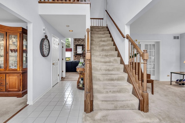 930 Ripple Brook Ln, Elgin, IL 60120 - foyer with stairway, light colored carpet, baseboards, and a towering ceiling