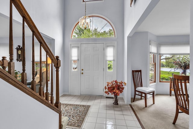 930 Ripple Brook Ln, Elgin, IL 60120 - entrance foyer featuring plenty of natural light, a chandelier, baseboards, and a towering ceiling