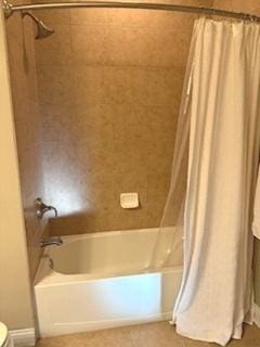 140 S River St Unit 208, Aurora, IL 60506 - bathroom featuring shower / tub combo with curtain and toilet