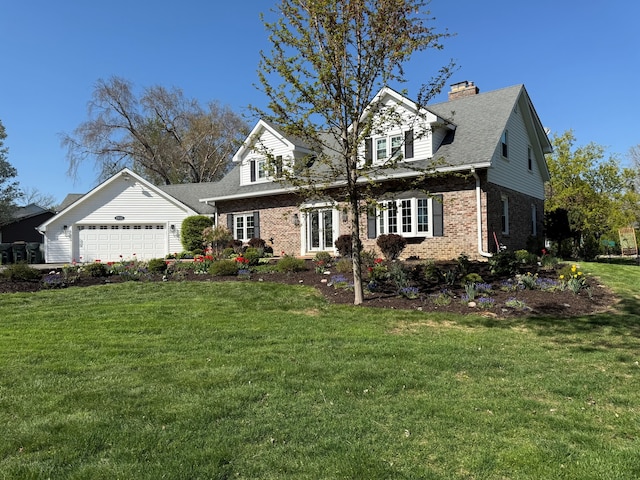 view of front of home featuring brick siding, a front yard, an attached garage, a chimney, and french doors