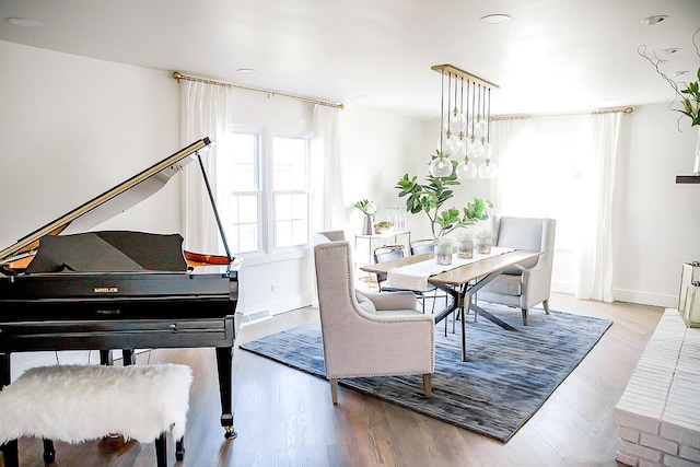 dining area featuring wood finished floors and baseboards