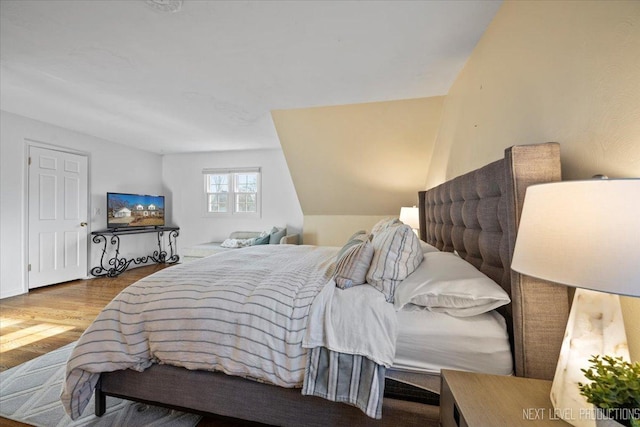 bedroom with wood finished floors