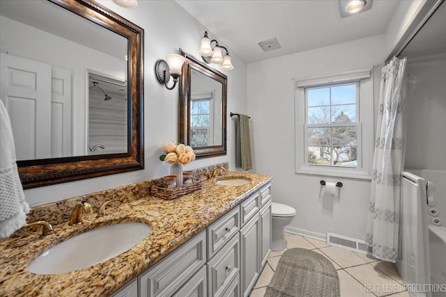 bathroom featuring tile patterned floors, double vanity, baseboards, toilet, and a shower with curtain