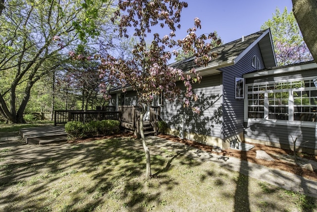 view of side of home featuring a deck