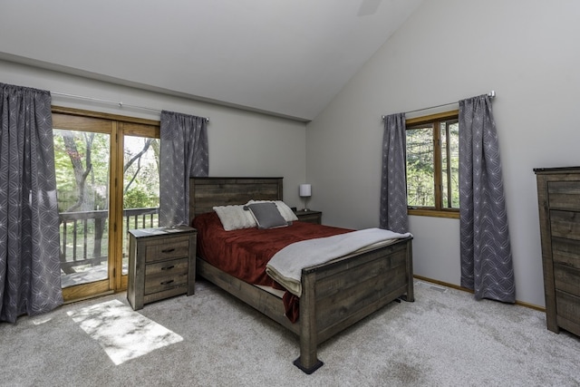 carpeted bedroom featuring access to outside, vaulted ceiling, and baseboards