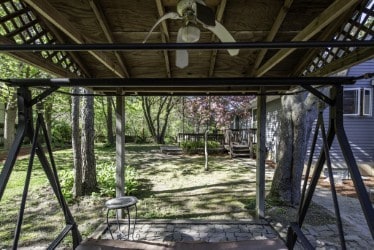 view of patio / terrace with a ceiling fan and a deck