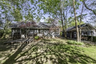 back of house with a deck
