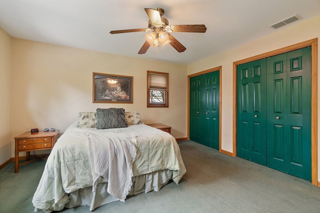 1536 N Elm St, Palatine, IL 60067 - carpeted bedroom featuring two closets, baseboards, and ceiling fan