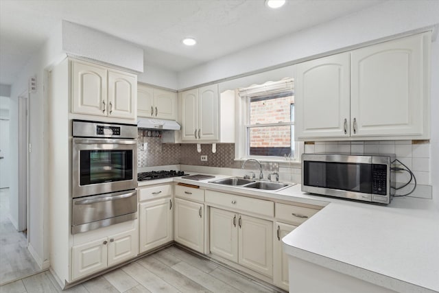 1230 W 112th Pl, Chicago, IL 60643 - kitchen featuring appliances with stainless steel finishes, a warming drawer, a sink, decorative backsplash, and recessed lighting