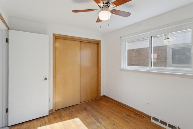 1230 W 112th Pl, Chicago, IL 60643 - unfurnished bedroom with a closet, wood finished floors, baseboards, and a ceiling fan