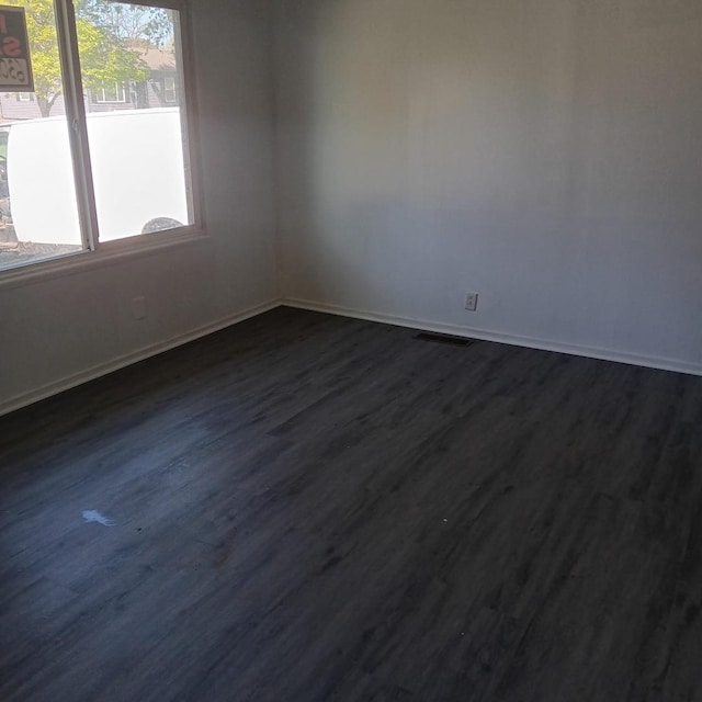430 Spring Ave, Dekalb, IL 60115 - empty room featuring dark wood-style floors and baseboards