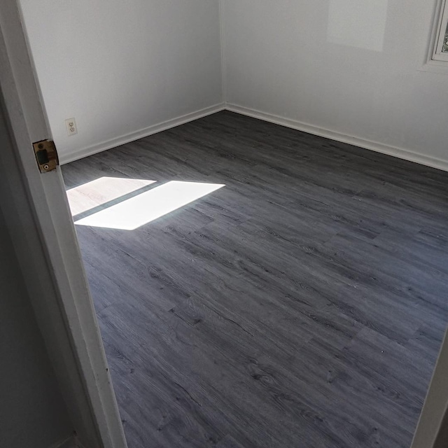 430 Spring Ave, Dekalb, IL 60115 - unfurnished room featuring dark wood-style floors and baseboards