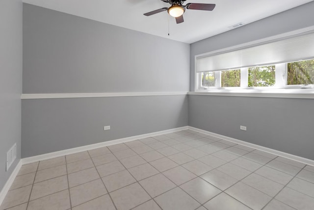 50 Kendal Rd, Elk Grove Village, IL 60007 - empty room with plenty of natural light, ceiling fan, light tile patterned floors, and baseboards