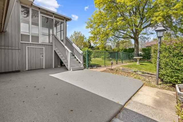 50 Kendal Rd, Elk Grove Village, IL 60007 - view of patio featuring fence, a sunroom, and stairway