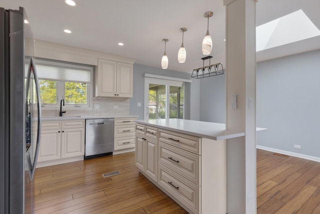50 Kendal Rd, Elk Grove Village, IL 60007 - kitchen with stainless steel appliances, light wood-style floors, light countertops, white cabinets, and recessed lighting