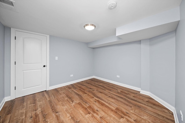 finished basement with wood finished floors and baseboards