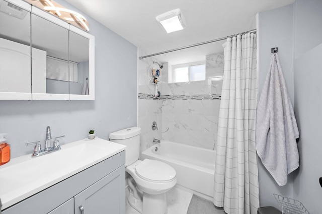 full bathroom featuring shower / tub combo, toilet, and vanity