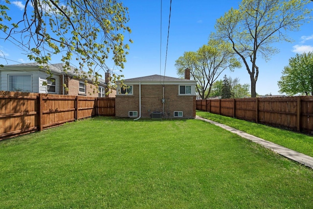 rear view of property with brick siding and a chimney