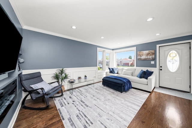 living room with crown molding, dark wood-style flooring, wainscoting, healthy amount of natural light, and recessed lighting