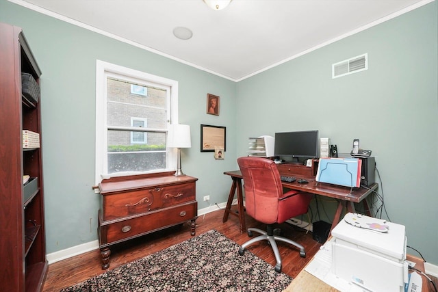 home office featuring wood finished floors, ornamental molding, and baseboards