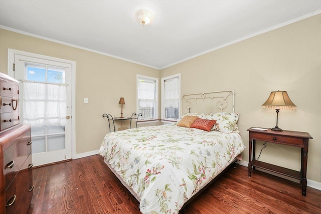bedroom with dark wood-style floors, baseboards, and ornamental molding