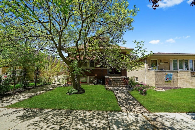 3732 Wisconsin Ave, Berwyn, IL 60402 - view of front facade with a front yard and brick siding