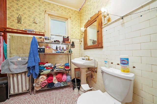 3732 Wisconsin Ave, Berwyn, IL 60402 - half bathroom featuring wallpapered walls, ornamental molding, wainscoting, toilet, and a sink