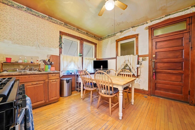 3732 Wisconsin Ave, Berwyn, IL 60402 - dining room featuring ceiling fan, light wood-style flooring, and wallpapered walls
