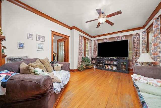 3732 Wisconsin Ave, Berwyn, IL 60402 - living area featuring a ceiling fan, wood-type flooring, ornamental molding, and baseboards