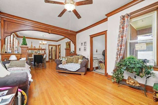 3732 Wisconsin Ave, Berwyn, IL 60402 - living area with a chandelier, light wood-style flooring, ceiling fan, arched walkways, and ornamental molding