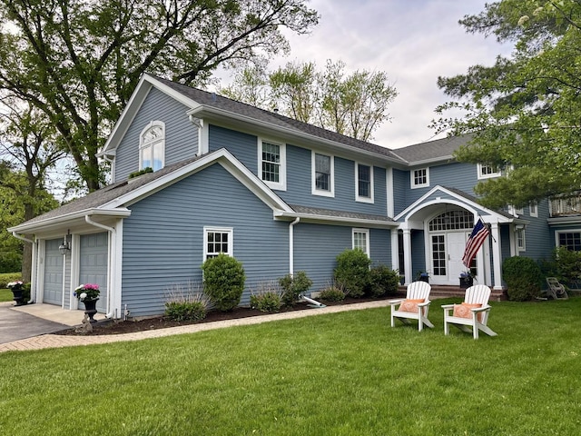 11 Longmeadow Rd, Winnetka, IL 60093 - view of front facade with a garage, a front lawn, and asphalt driveway