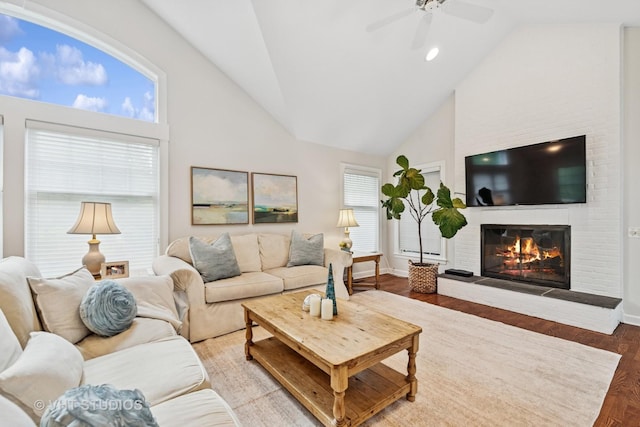 11 Longmeadow Rd, Winnetka, IL 60093 - living area with high vaulted ceiling, a ceiling fan, a brick fireplace, wood finished floors, and baseboards