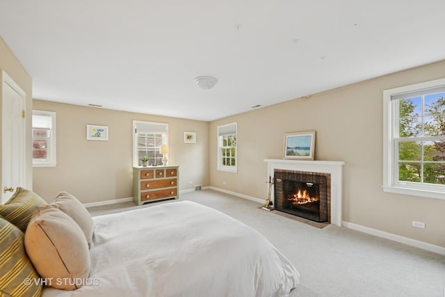 11 Longmeadow Rd, Winnetka, IL 60093 - bedroom featuring multiple windows, a fireplace, light colored carpet, and baseboards