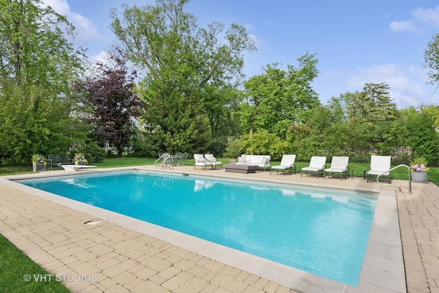 11 Longmeadow Rd, Winnetka, IL 60093 - outdoor pool featuring a patio, outdoor lounge area, view of wooded area, and a diving board