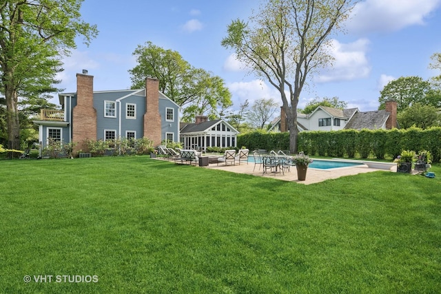 11 Longmeadow Rd, Winnetka, IL 60093 - rear view of house with a chimney, a patio area, and a yard