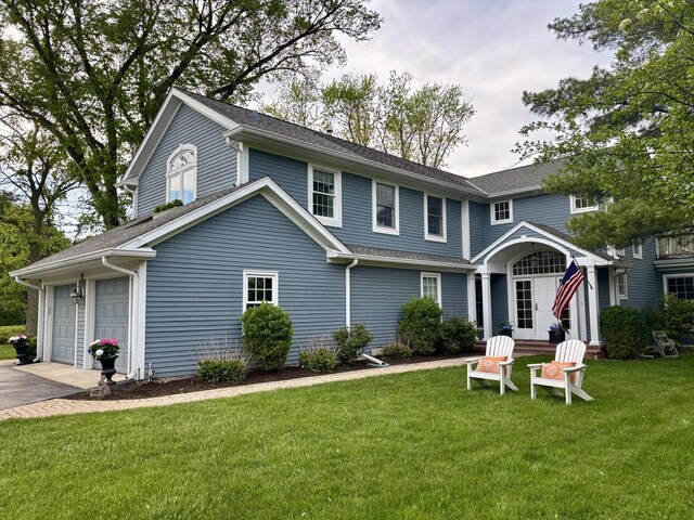 11 Longmeadow Rd, Winnetka, IL 60093 - view of front of property with a garage, a front lawn, and asphalt driveway