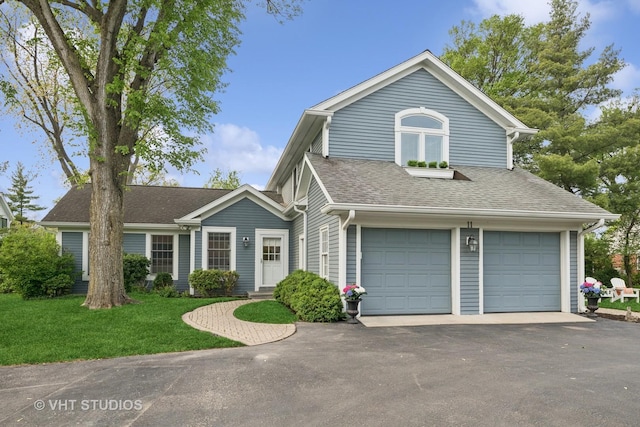 11 Longmeadow Rd, Winnetka, IL 60093 - view of front of home featuring a shingled roof, driveway, a front yard, and a garage