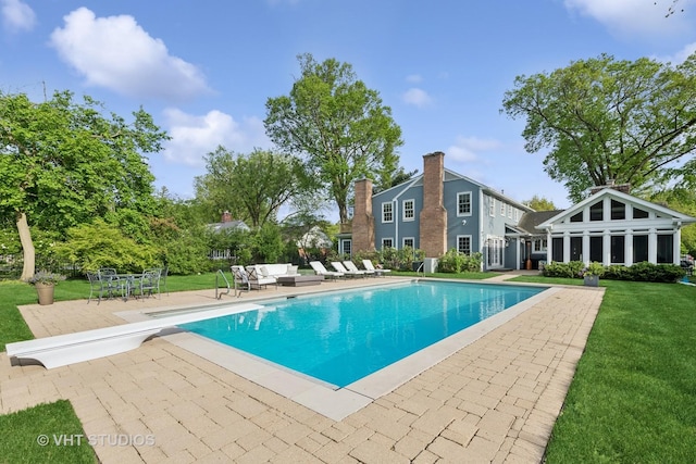 11 Longmeadow Rd, Winnetka, IL 60093 - swimming pool featuring a patio area, a diving board, a yard, and an outdoor living space