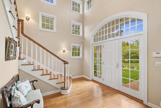 11 Longmeadow Rd, Winnetka, IL 60093 - foyer with a high ceiling, wood finished floors, plenty of natural light, baseboards, and stairs