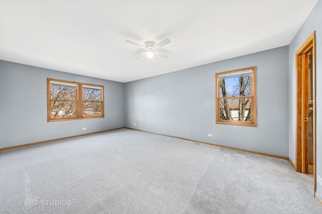 13523 S Red Coat Dr, Lemont, IL 60439 - unfurnished room featuring ceiling fan, healthy amount of natural light, baseboards, and carpet floors