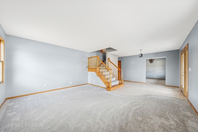 13523 S Red Coat Dr, Lemont, IL 60439 - unfurnished living room with stairs, baseboards, and carpet