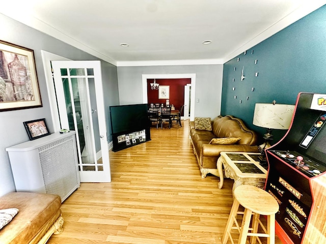 1258 Perry St, Des Plaines, IL 60016 - living area featuring wood finished floors, a chandelier, and crown molding