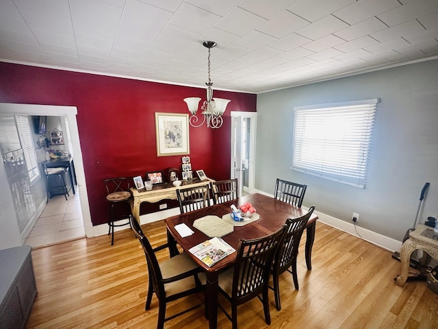 1258 Perry St, Des Plaines, IL 60016 - dining room featuring a chandelier, light wood finished floors, baseboards, and crown molding